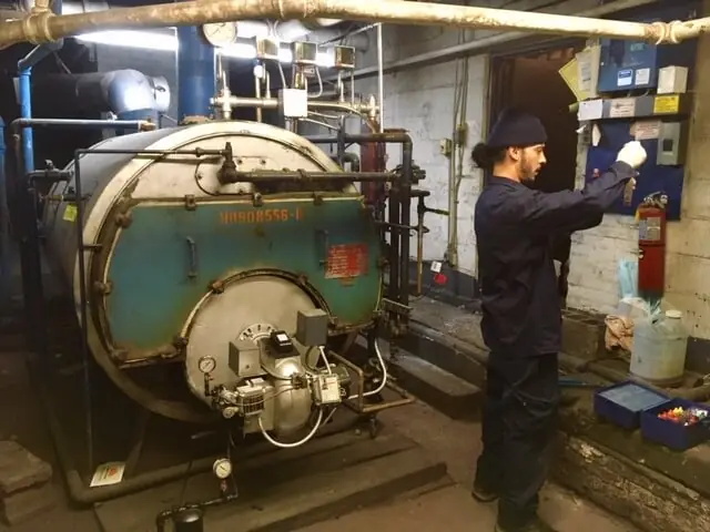 a Metro Group technician performing boiler service and repair